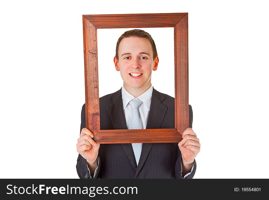Friendly businessman with wooden frame isolated on white background