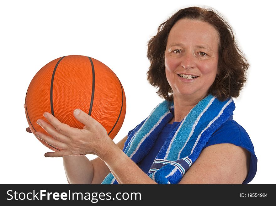 Middle aged woman with basketball on white background