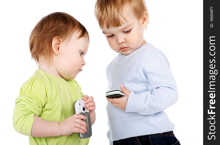 Surprised little girl and boy with the phone isolated