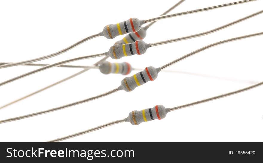 Some resistors on a light background. Isolated on white. Some resistors on a light background. Isolated on white.