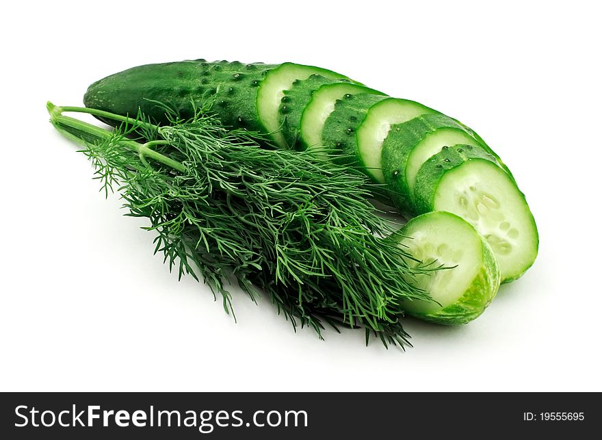 Sliced cucumber and dill isolated on white background