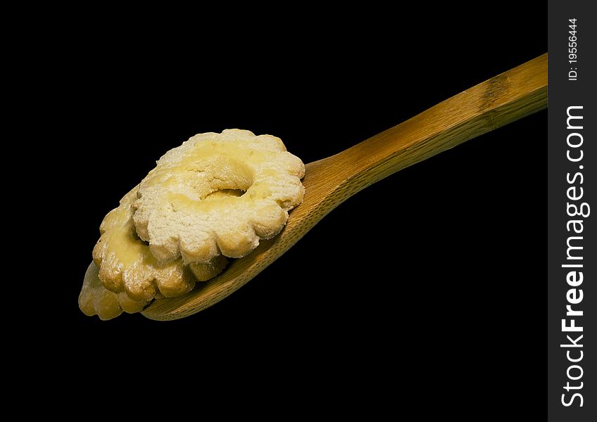 Traditional italian biscuit and wooden spoon isolated on white background