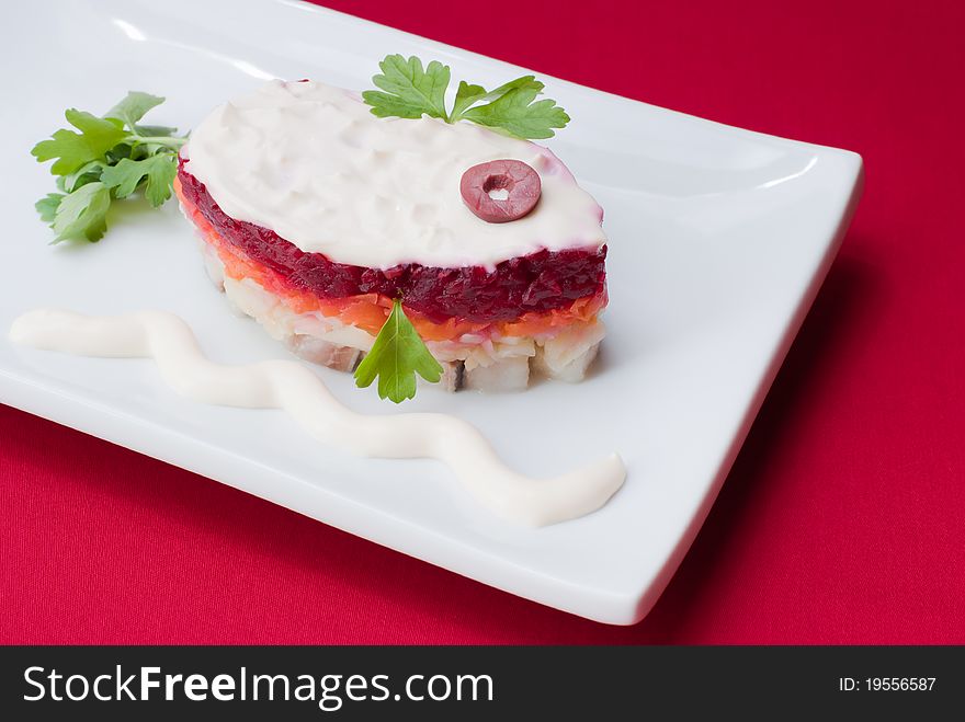 Russian salad Herring under fur coat, traditional holiday meal, selective focus.