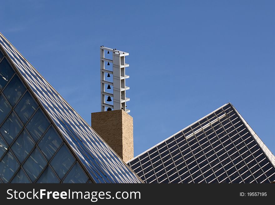 Carillon bells framed by pyramid-shaped rooftops. Carillon bells framed by pyramid-shaped rooftops.