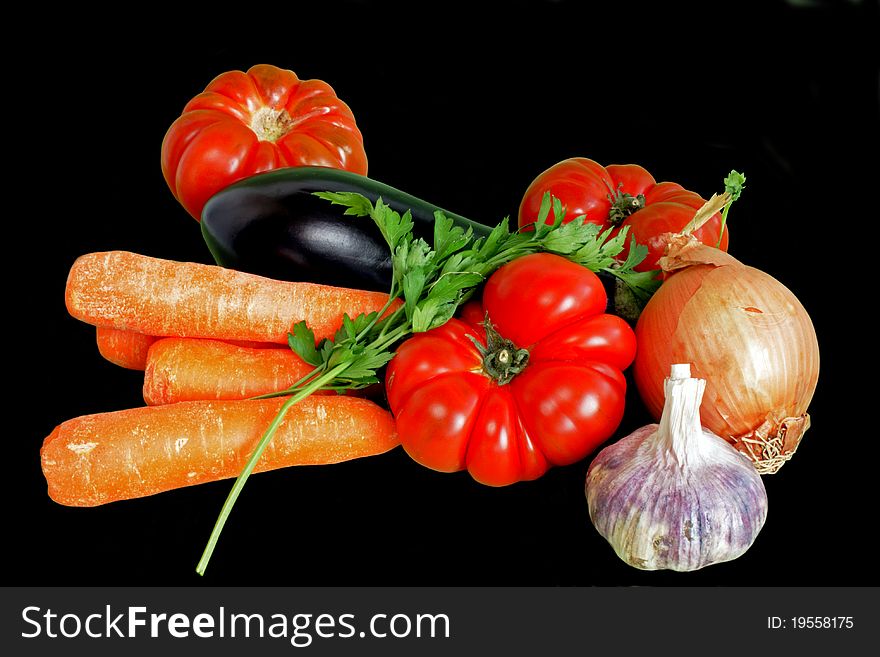 Fresh ripe vegetables isolated over black