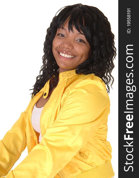 A young pretty African American woman sitting on an chair in white tights and a yellow jacket from the back, looking over her shoulder, for white background. A young pretty African American woman sitting on an chair in white tights and a yellow jacket from the back, looking over her shoulder, for white background.