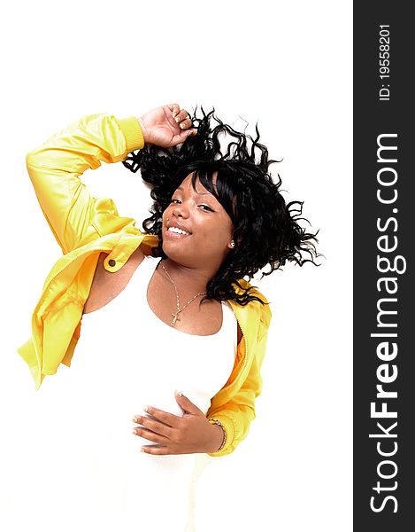 A beautiful young African American woman lying in a yellow jacket and white t-shirt on the floor, her black hair spread out, over white Background. A beautiful young African American woman lying in a yellow jacket and white t-shirt on the floor, her black hair spread out, over white Background.