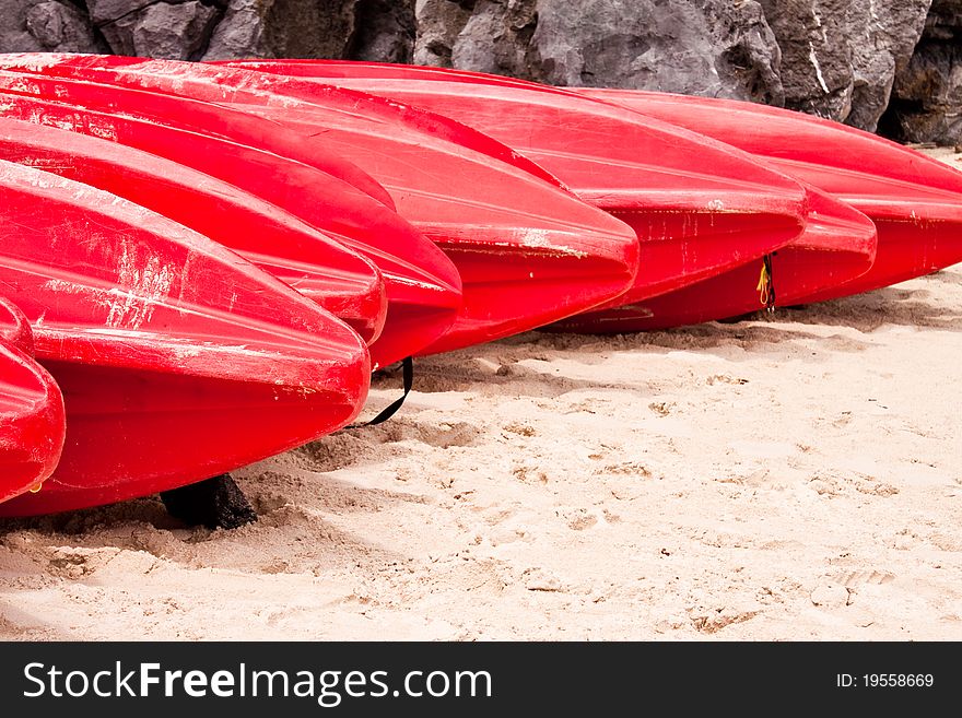 The red kayaks on the beach