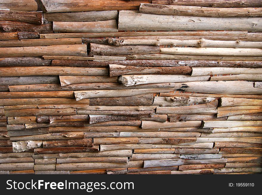 Wall made of logs of various sizes. Wall made of logs of various sizes.