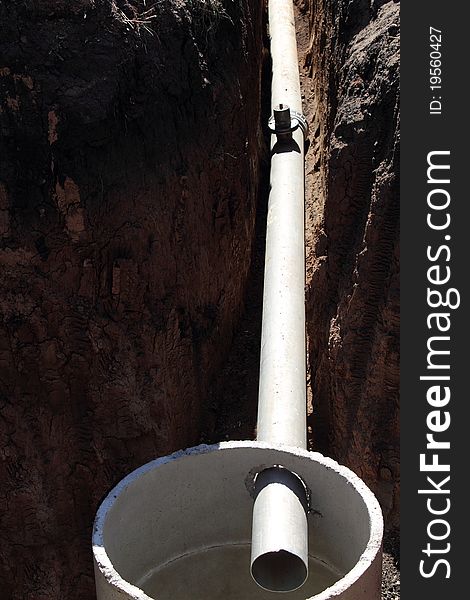 Pipe in a trench during pipeline construction. Pipe in a trench during pipeline construction