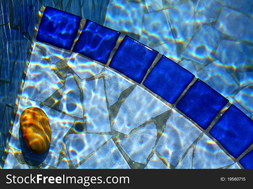 Beautiful colours and patterns dance off pool water. Beautiful colours and patterns dance off pool water