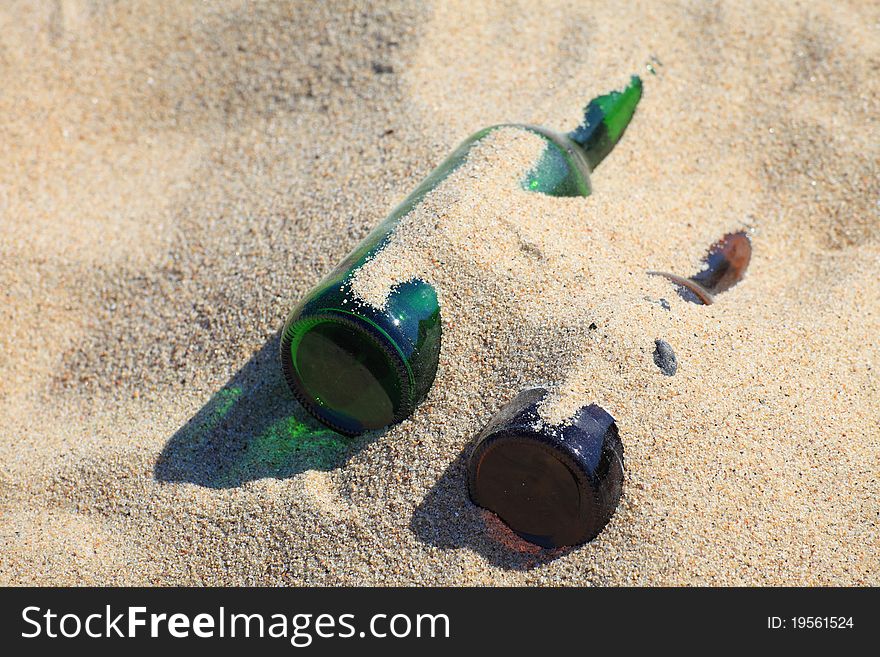 Bottle On Beach Sand