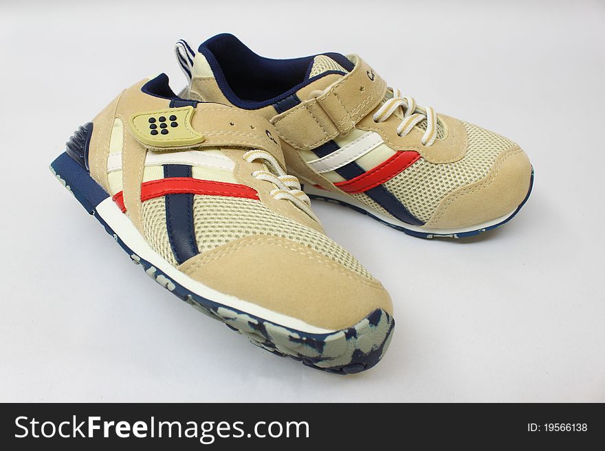 A pair of kid leisure shoes isolated. A pair of kid leisure shoes isolated