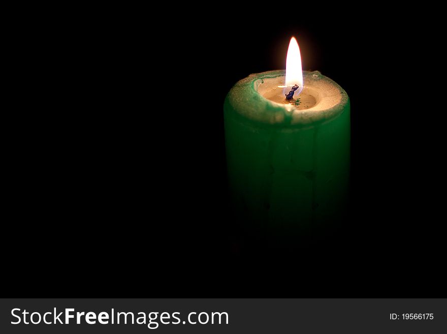 A candle shining in the darkness.