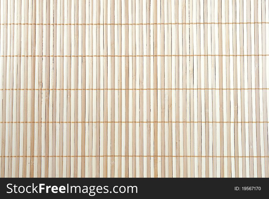 Beige striped background of a wooden mat