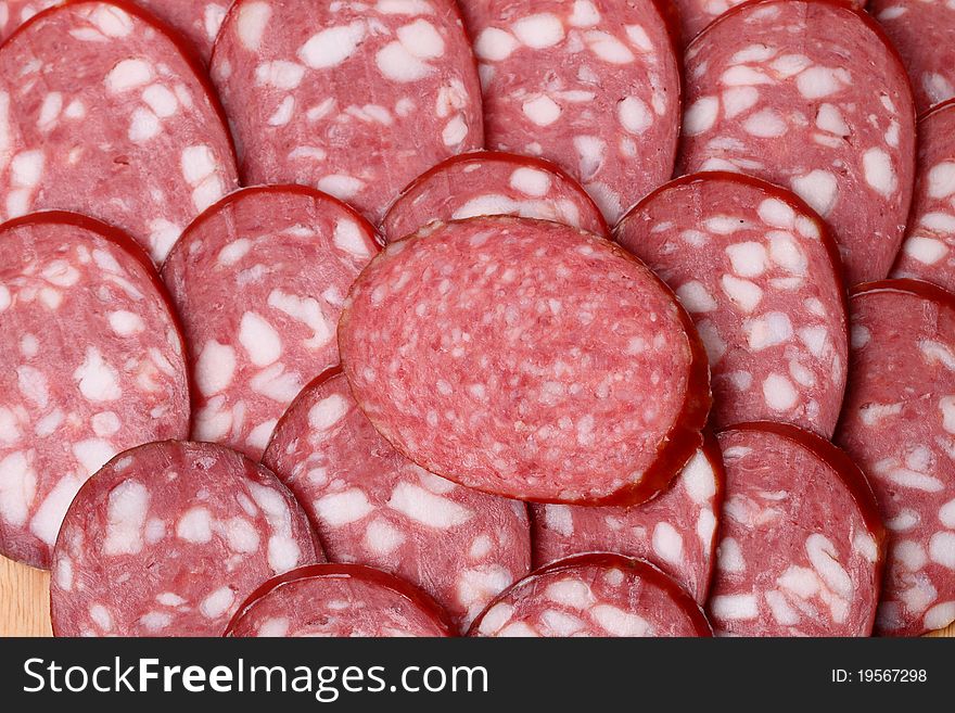 Smoked sausage (cervelat) background. A series of food backgrounds. Smoked sausage (cervelat) background. A series of food backgrounds