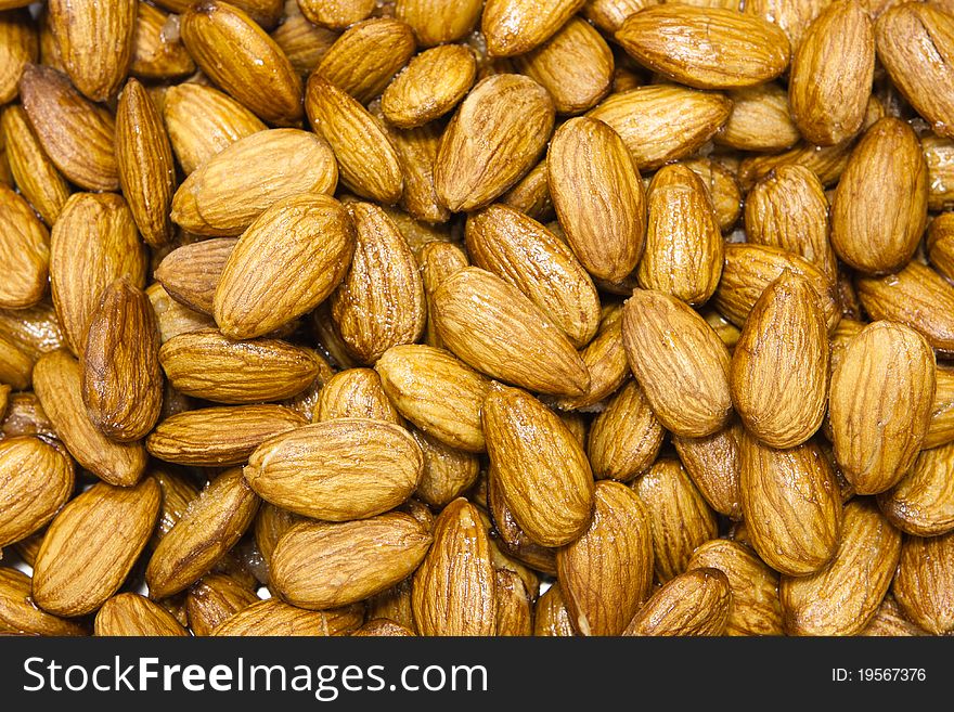 The almonds background. closeup macro almonds in honey