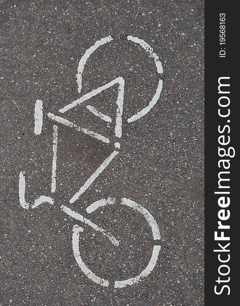 White bicycle on asphalt