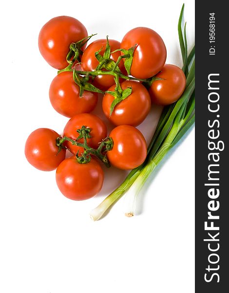 Wet whole tomatos arranged at the market isolated on a white background