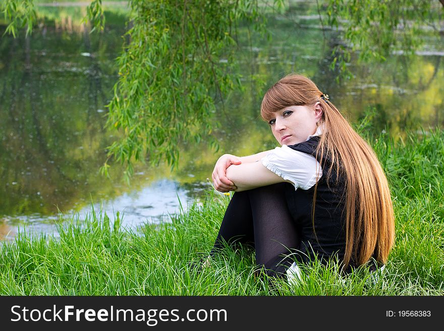 Single woman relaxing at the park