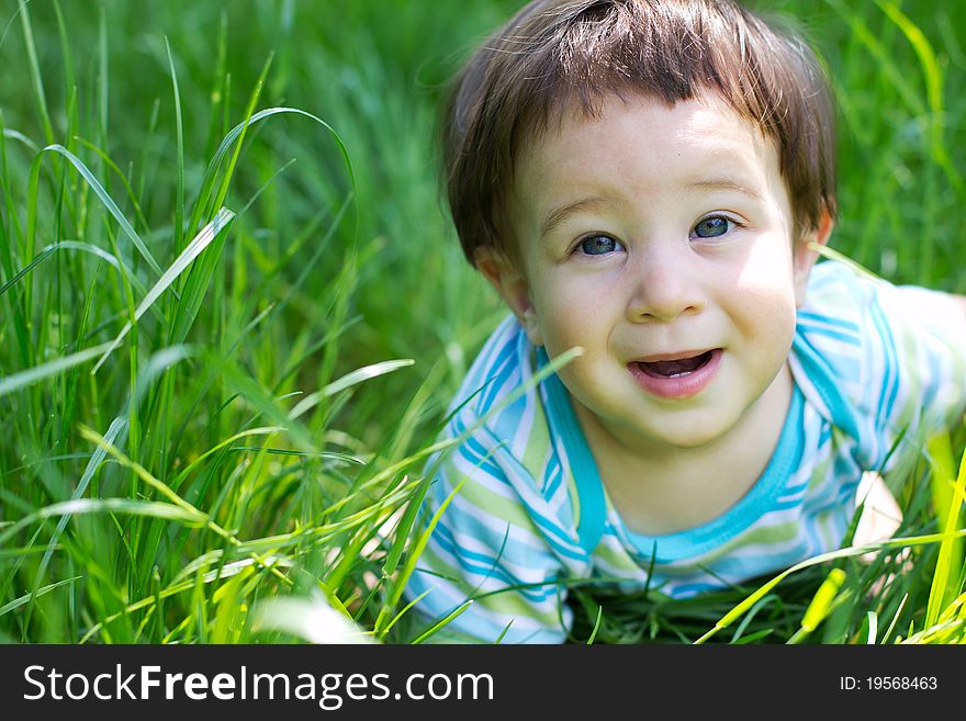 Little boy on the green grass. Little boy on the green grass
