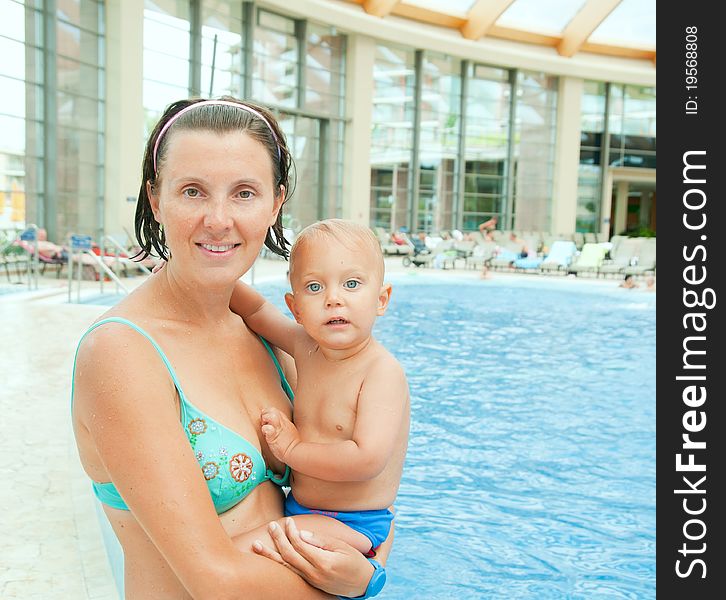 The mother and the baby boy in aquapark. The mother and the baby boy in aquapark