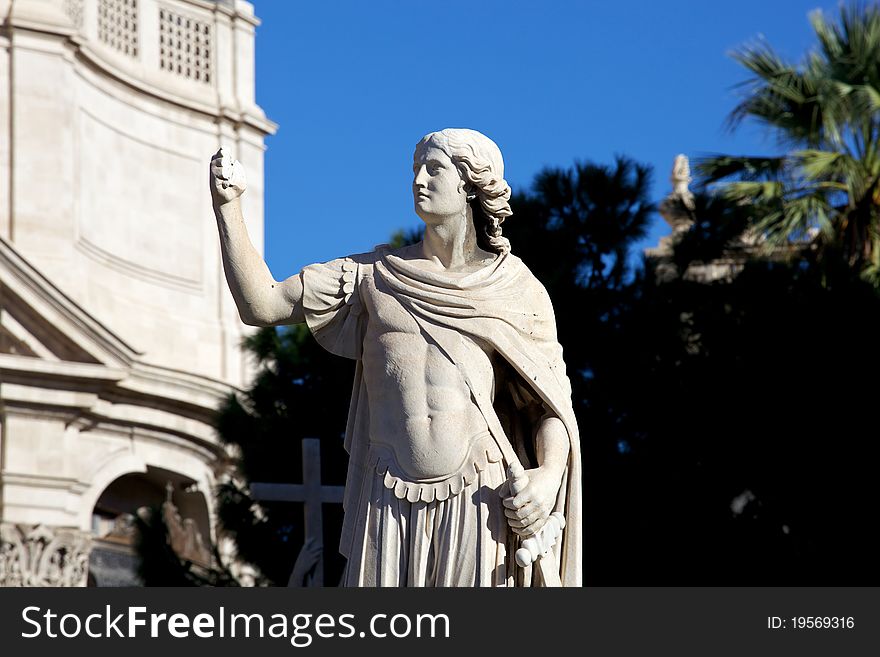 Statue of  an ancient religious figure next to the cathedral of Catania