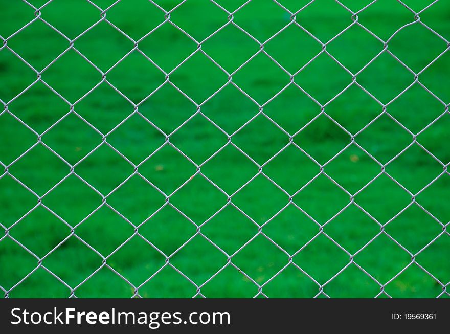 Iron Wire Fence Green Background