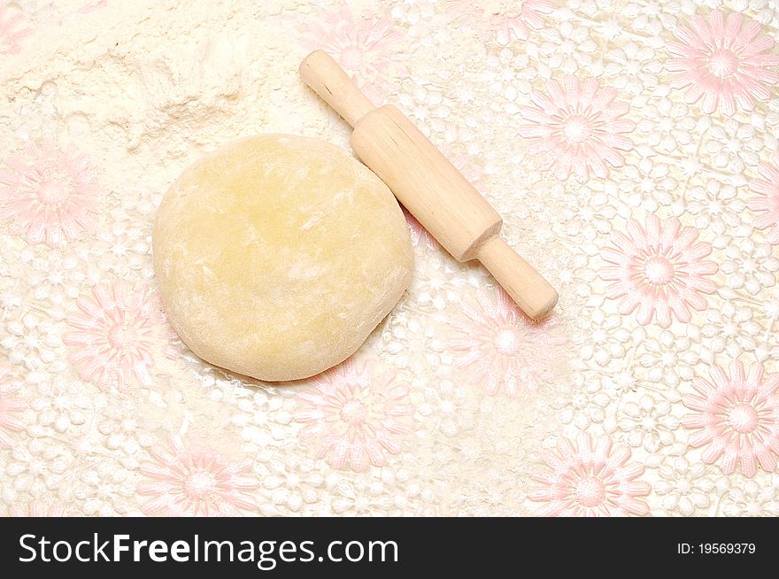 Floured rolling pin on dough