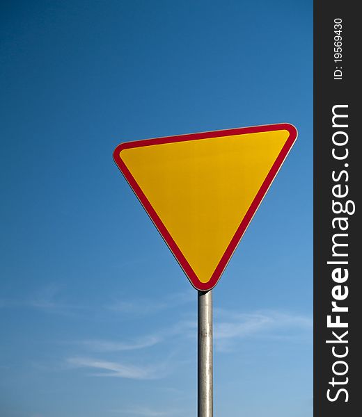 Photo of a road sign - give way to the right of way. Photo of a road sign - give way to the right of way