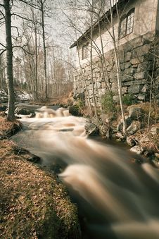 Spring Flood Running Past Old Smeltery Stock Photo