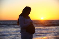 Pregnant Woman During Sunset At The Beach Stock Image