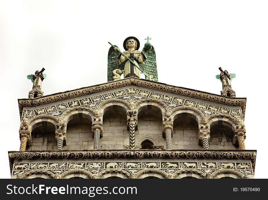 Angel statues and ornate decorations from the cathedral in Lucca, Italy. Isolated on white. Angel statues and ornate decorations from the cathedral in Lucca, Italy. Isolated on white.