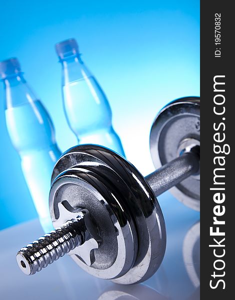 Dumbells and bottles of mineral water