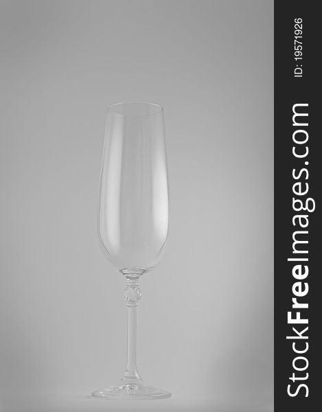 Clean wineglass on gray background