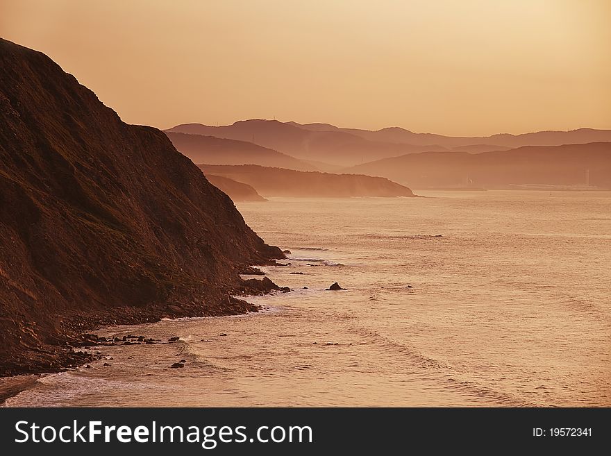 An image of the Basque coast in sunset time. An image of the Basque coast in sunset time