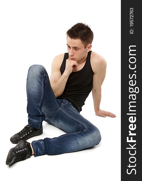 Young man thinking and hand resting on. Young man thinking and hand resting on