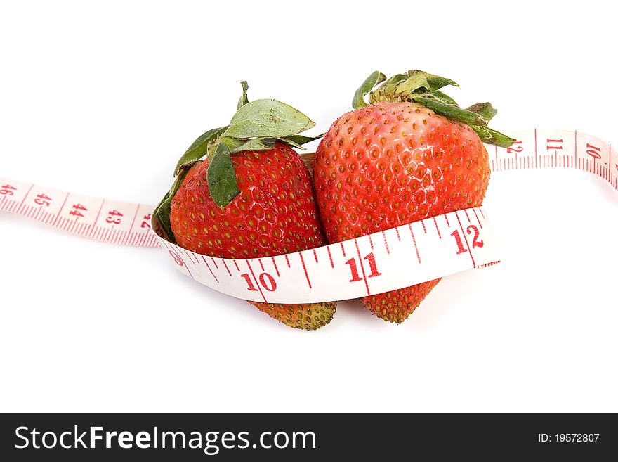 Image of two isolated strawberries with tape measure. Image of two isolated strawberries with tape measure