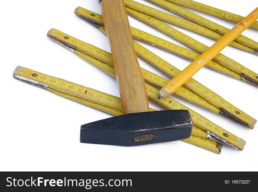 Hammer with Ruler against a white background