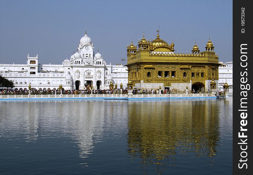 Close up of the Golden Temple with holy nectar tank and Clock Tower. Close up of the Golden Temple with holy nectar tank and Clock Tower
