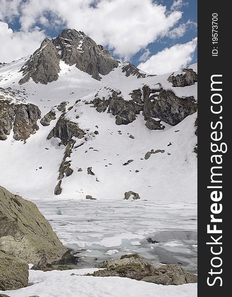 Frozen lake in italian alps