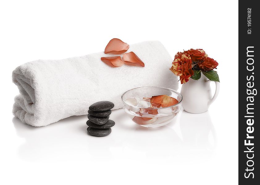 Spa with rose petals on white background