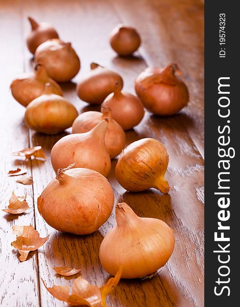 Small onions on a wooden table