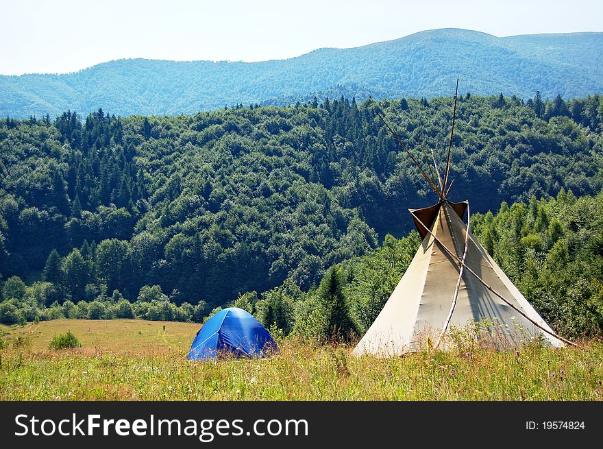 Camping with tent and teepee in mountains. Camping with tent and teepee in mountains