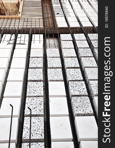 Technical detail of building operations: floor. Materials: polystyrene, steel bars, concrete. Technical detail of building operations: floor. Materials: polystyrene, steel bars, concrete