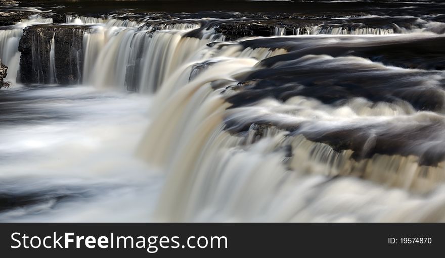 Flowing waterfall and river yorkshire. Flowing waterfall and river yorkshire