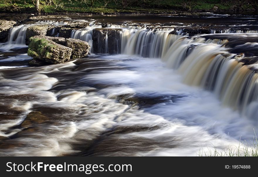 Flowing waterfall and river yorkshire. Flowing waterfall and river yorkshire
