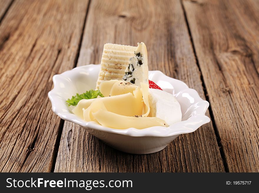 Various types of cheese in a serving bowl. Various types of cheese in a serving bowl