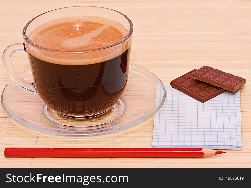 Coffee, red pen and chocolate