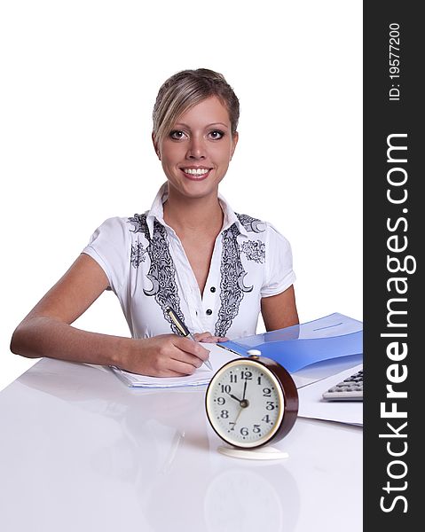 Businesswoman sitting at table with documents